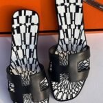Hermès Printed Oran Flat Sandals Black