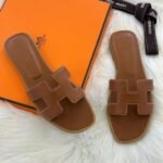 Hermès Oran Flat Sandals Tan