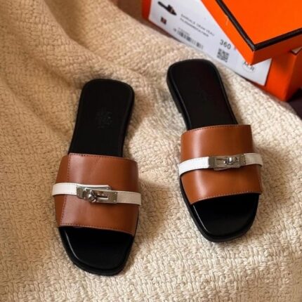 Hermès Gigi Giulia Flats Sandals Slip-Ons Black & Tan White Buckle
