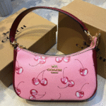 Coach Teri Shoulder Hand Bag In Signature Canvas Cherry Print Pink with Free Perfume