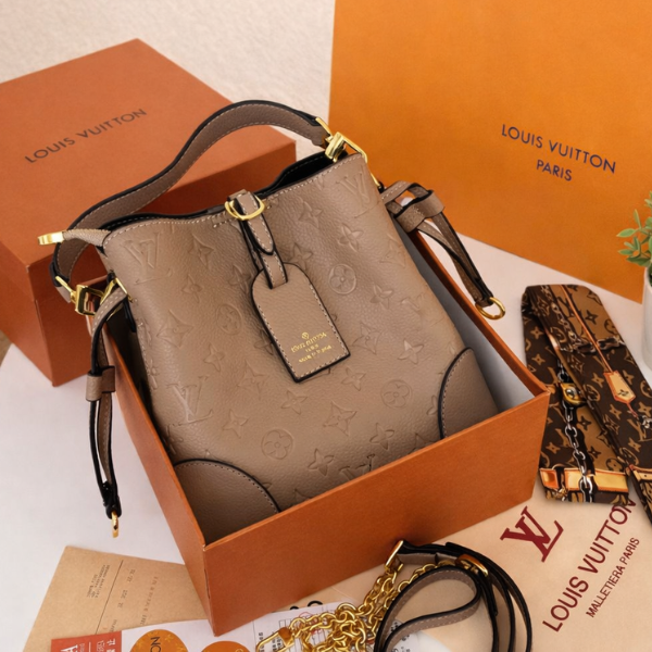 LLV (9) Louis Vuitton Monogram Embossed Leather Bucket Hand Shoulder Crossbody Chain Strap Bag Beige with Free Perfume - Image 1